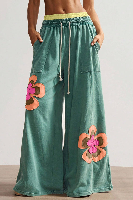 Sea green flower patched drawstring pants by FashionWorks featuring contrast elastic waistband and floral patch details.
