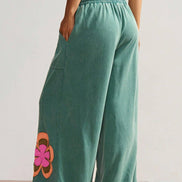 Sea green Fashionworks flower-patched drawstring pants with elastic waistband and contrasting patch details.