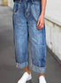 A pair of stitched raw hem wide-leg loose jeans from Aapparella featuring distressed details and relaxed fit.