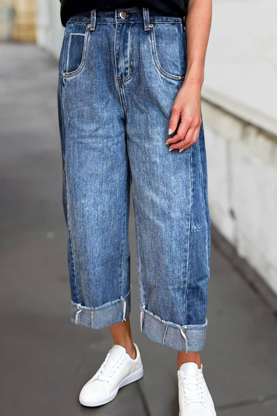 A pair of stitched raw hem wide-leg loose jeans from Aapparella featuring distressed details and relaxed fit.
