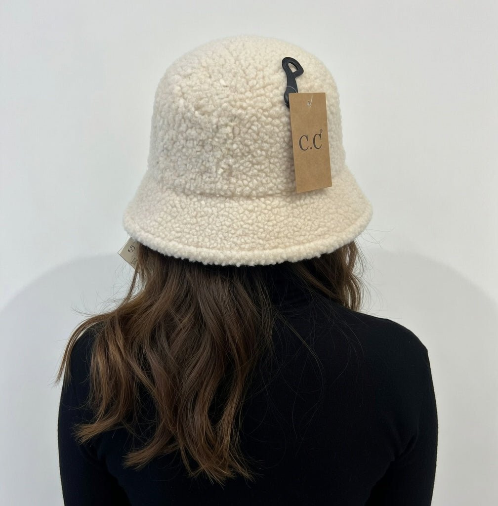 Hana C.C Rubber Patch Sherpa Bucket Hat featuring a soft sherpa fabric and rubber patch detail, perfect for casual outdoor wear.