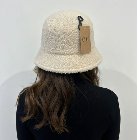 Hana C.C Rubber Patch Sherpa Bucket Hat featuring a soft sherpa fabric and rubber patch detail, perfect for casual outdoor wear.