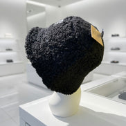 Hana C.C Rubber Patch Sherpa bucket hat with a wide brim and embroidered rubber patch, featuring cozy sherpa fabric and casual style.
