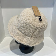 Hana C.C Rubber Patch Sherpa Bucket Hat with embroidered logo and plush sherpa lining, casual outdoor accessory.