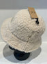 Hana C.C Rubber Patch Sherpa Bucket Hat with embroidered logo and plush sherpa lining, casual outdoor accessory.