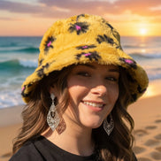 Black floral faux fur bucket hat by Hana with a soft, plush texture and stylish floral pattern for a trendy winter accessory.