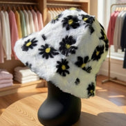 Hana floral faux fur bucket hat with colorful flower patterns and soft texture, perfect for stylish winter accessories.