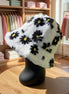 Hana floral faux fur bucket hat with colorful flower patterns and soft texture, perfect for stylish winter accessories.