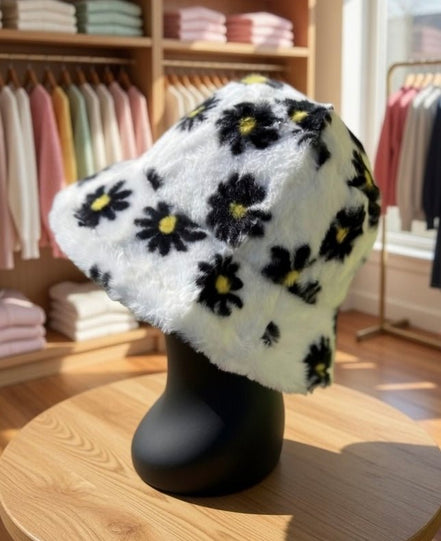Hana floral faux fur bucket hat with colorful flower patterns and soft texture, perfect for stylish winter accessories.
