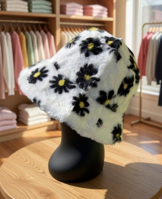 Hana floral faux fur bucket hat with colorful flower patterns and soft texture, perfect for stylish winter accessories.