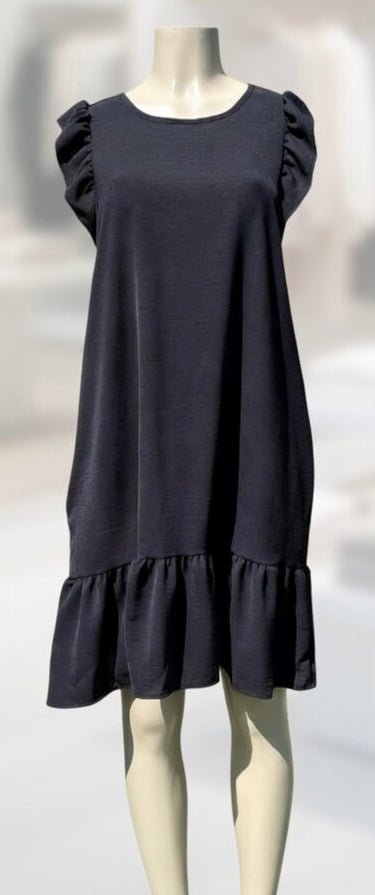 Heimish Lil’ Black Dress showcasing its classic design, sleek fit, and stylish fabric for any occasions.