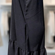 Heimish Lil’ Black Dress showcasing its simple elegant design and classic black color.