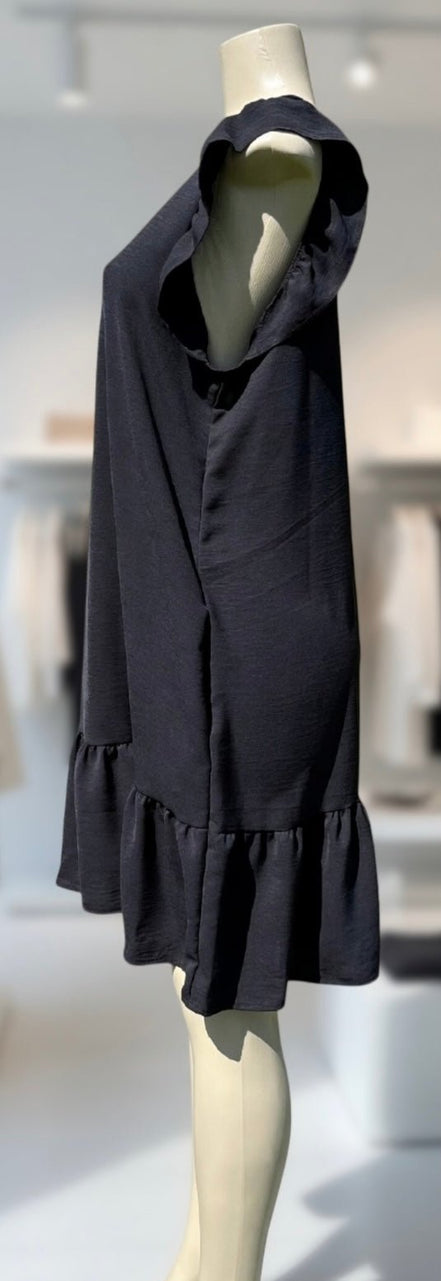 Heimish Lil’ Black Dress showcasing its simple elegant design and classic black color.
