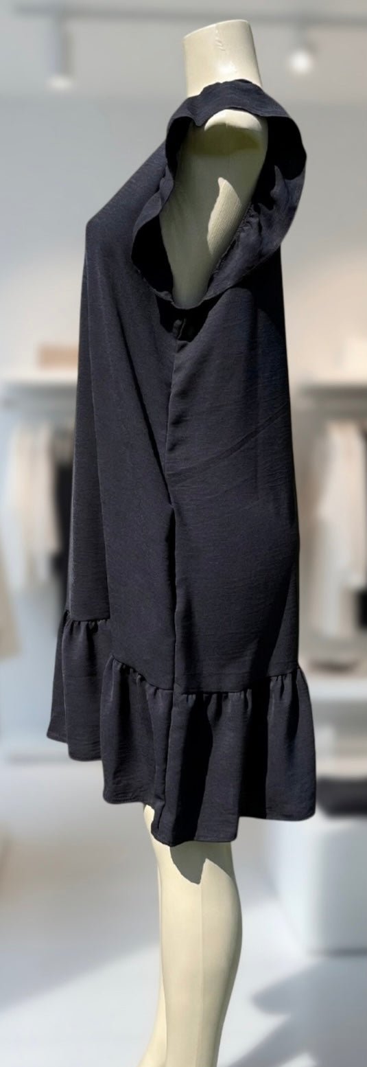 Heimish Lil’ Black Dress showcasing its simple elegant design and classic black color.