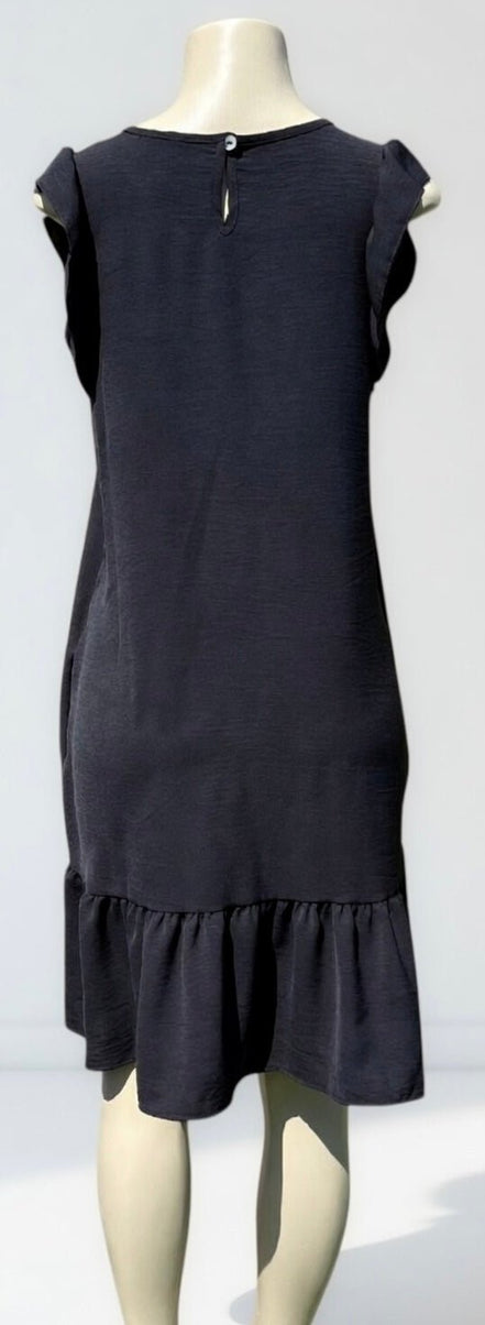 Heimish Lil’ Black Dress displayed on a mannequin, showcasing its classic silhouette and stylish design for women.