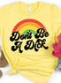 Pale yellow retro T-shirt by House Of Rodan with humorous "Don't Be A Dick Rainbow" adult humor design.