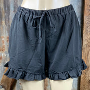 Main Strip brand. Drawstring tie waisted shorts with ruffled bottom hem. Loose fit. Available in Dusty Rose and Black.