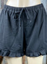 Main Strip brand. Drawstring tie waisted shorts with ruffled bottom hem. Loose fit. Available in Dusty Rose and Black.