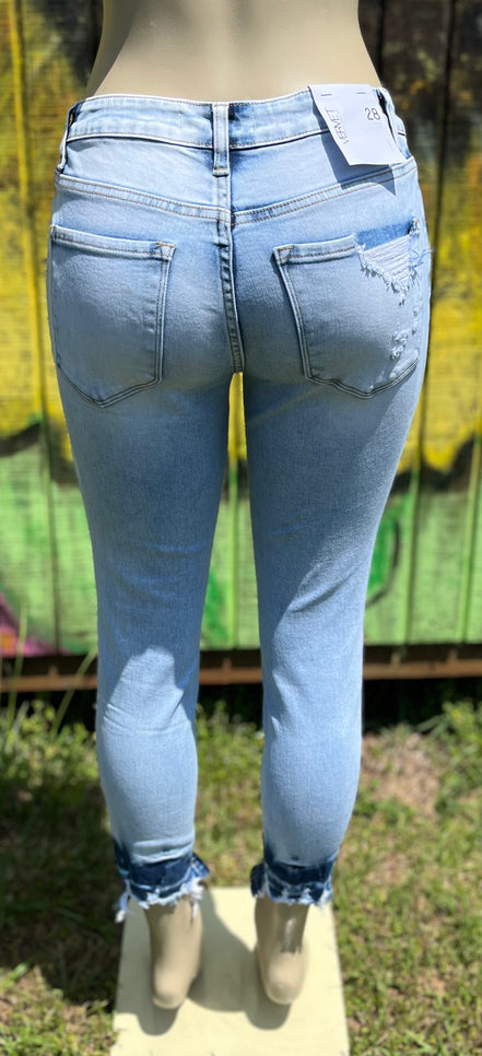 VERVET mid rise skinny jeans in classic blue denim with five-pocket design and fitted silhouette.