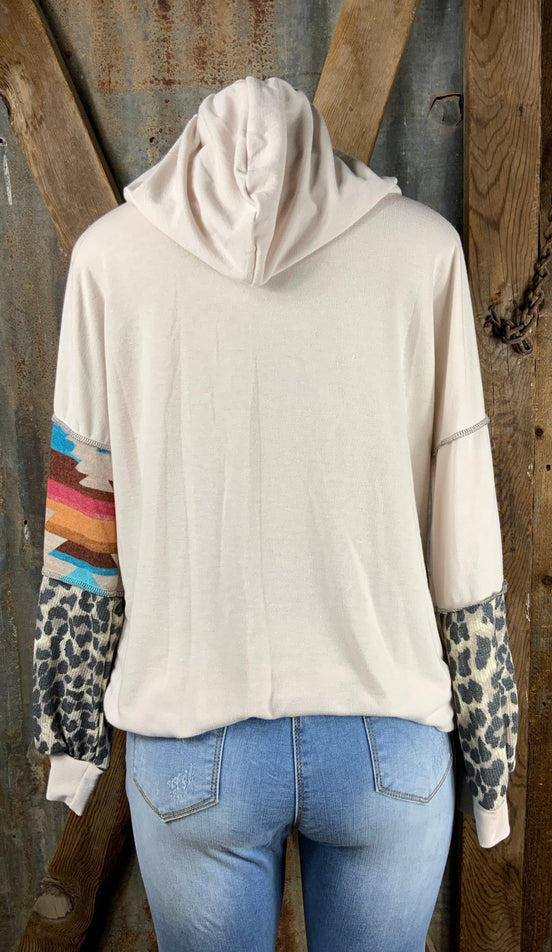 Lovely J. Aztec and animal print design contrasting with solid beige top with drawstring hoodie.  Small $15