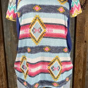 Celeste Clothing brand. Aztec and striped design print with navy accents, short sleeves with multicolored chevron pattern.