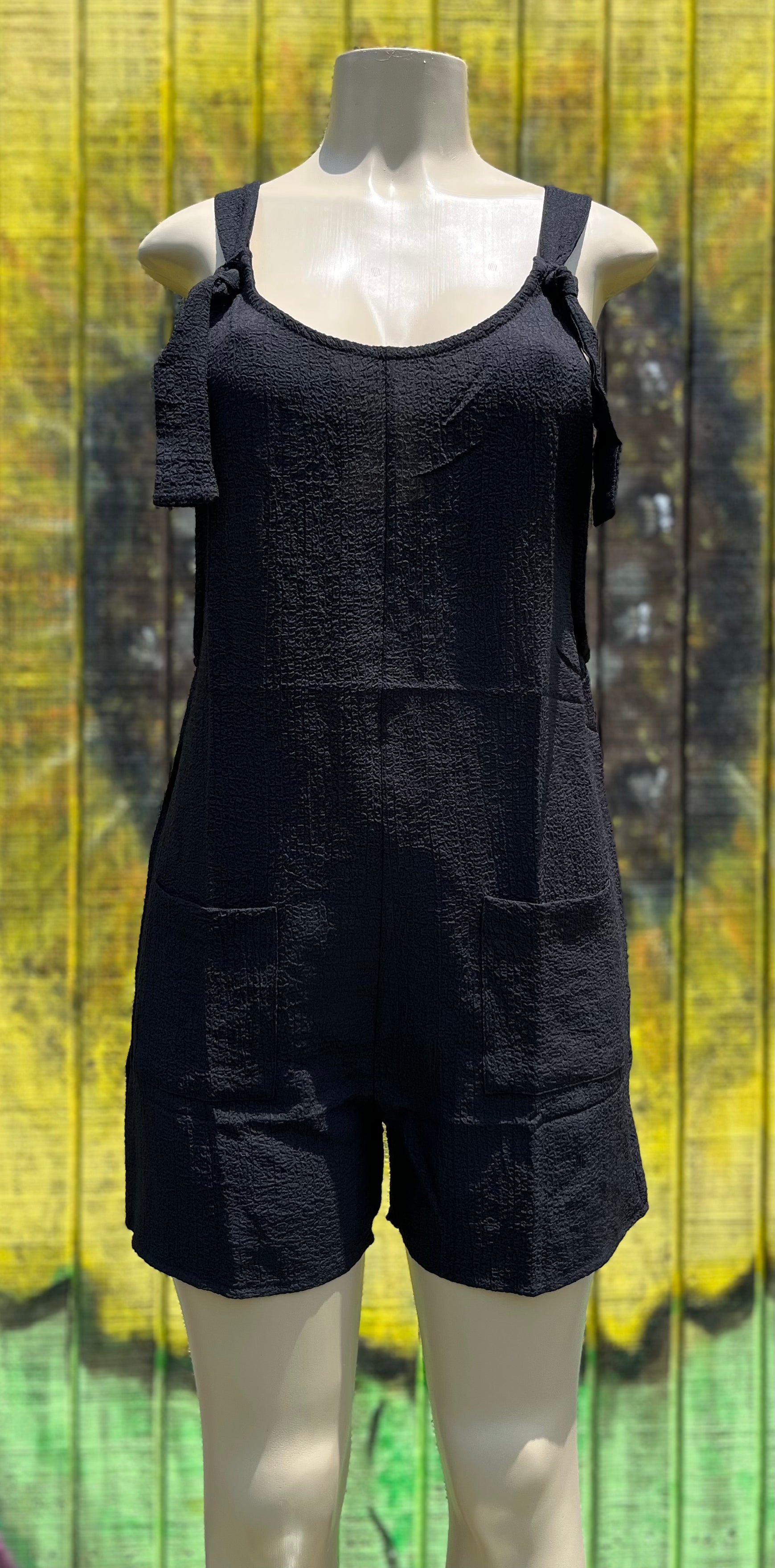 Black romper by Shiying Fashion featuring a fitted sleeveless design and casual style, perfect for summer wear.
