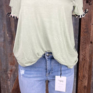 Celeste Clothing brand. Light sage green top with leopard trim cut out detail on neck and sleeves. S, M, L, XL. $15