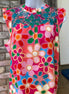 Pink floral blouse from Shiying Fashion featuring a lightweight fabric and delicate floral pattern, shown on a hanger.