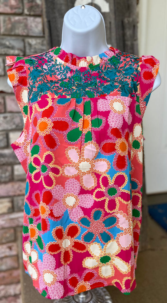 Pink floral blouse from Shiying Fashion featuring a lightweight fabric and delicate floral pattern, shown on a hanger.