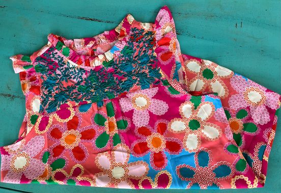 Pink floral blouse by Shiying Fashion featuring lightweight fabric and a relaxed fit, displayed on a hanger.