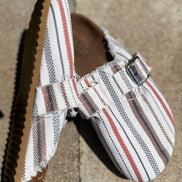 Unishe flat half slip-on shoes in black with a sleek design, featuring a rounded toe and comfortable slip-on style.
