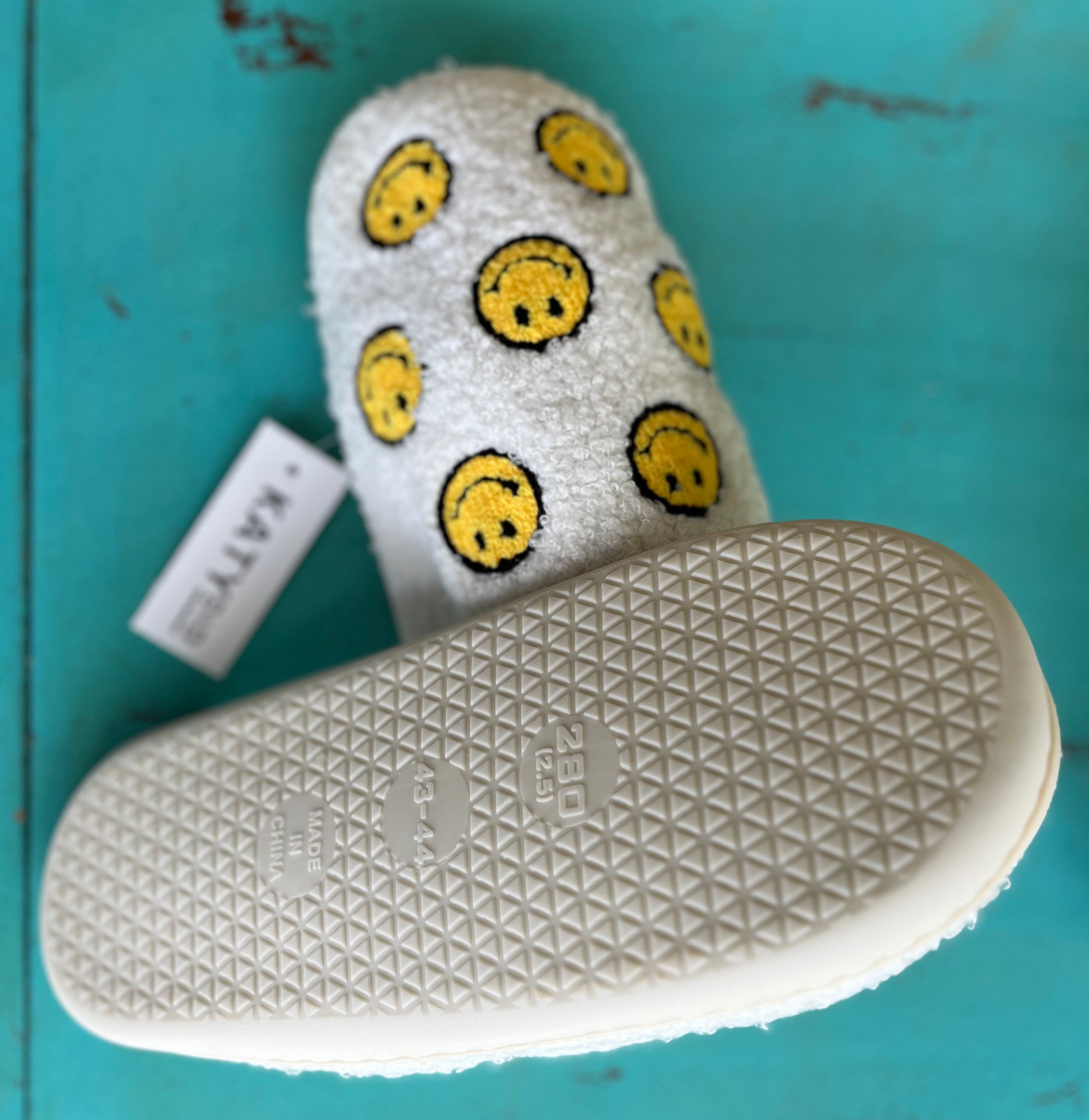 Colorful Smiles All Over print fabric by Katydid, featuring vibrant, cheerful smiley face pattern on soft, lightweight material.