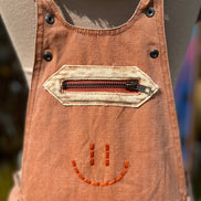 Washed cargo romper by Oli&Hali featuring a relaxed fit, multiple pockets, and casual style in soft, durable fabric.