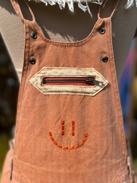 Washed cargo romper by Oli&Hali featuring a relaxed fit, multiple pockets, and casual style in soft, durable fabric.