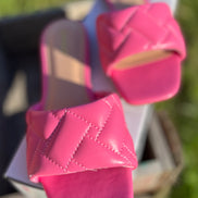 Pink Stella Shoes sandals with open toes and ankle straps, showcasing a stylish summer footwear design.