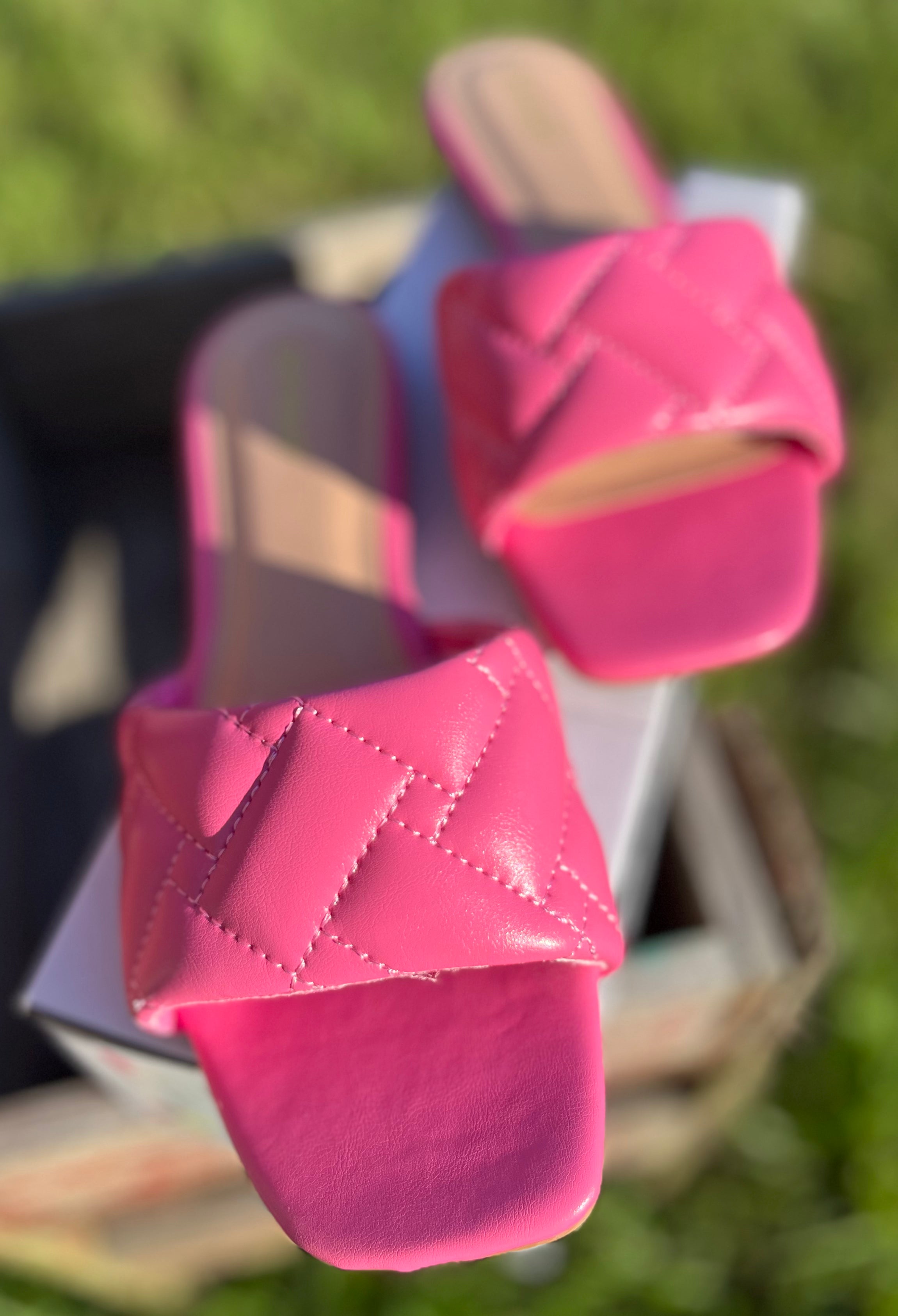 Pink Stella Shoes sandals with open toes and ankle straps, showcasing a stylish summer footwear design.