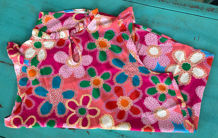 Pink floral blouse by Shiying Fashion featuring a lightweight fabric and delicate flower print, displayed on a hanger.