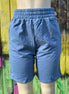 Vintage blue shorts by Vanilla Monkey, casual denim style with front pockets and rolled hem, displayed on a neutral background.