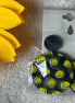 Avenue Zoe brand. Available in black or white hard resin with yellow happy faces and post back earrings. $10