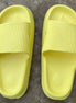 Yellow rubber platform slides by Shop Lev, featuring a chunky sole and open-toe design for casual summer wear.