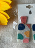 Avenue Zoe brand. Abstract dangle with post back. White, coral, green, yellow and navy. $10