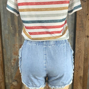 ESLEY brand. High-waisted, light wash denim. Available in blush or blue. Top clasp w/ elastic waist, pockets & shredded hem.