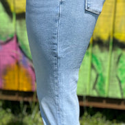 Vervet mid-rise skinny jeans in classic blue denim, fitted style with front pockets and belt loops, close-up view of fabric and stitching
