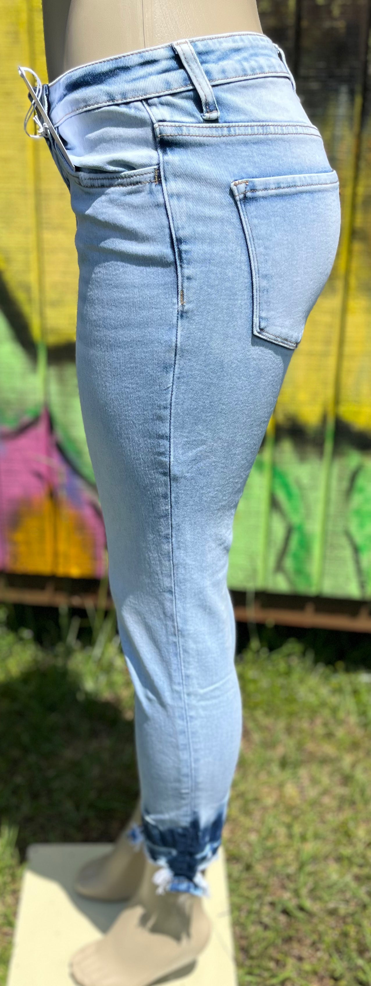 Vervet mid-rise skinny jeans in classic blue denim, fitted style with front pockets and belt loops, close-up view of fabric and stitching