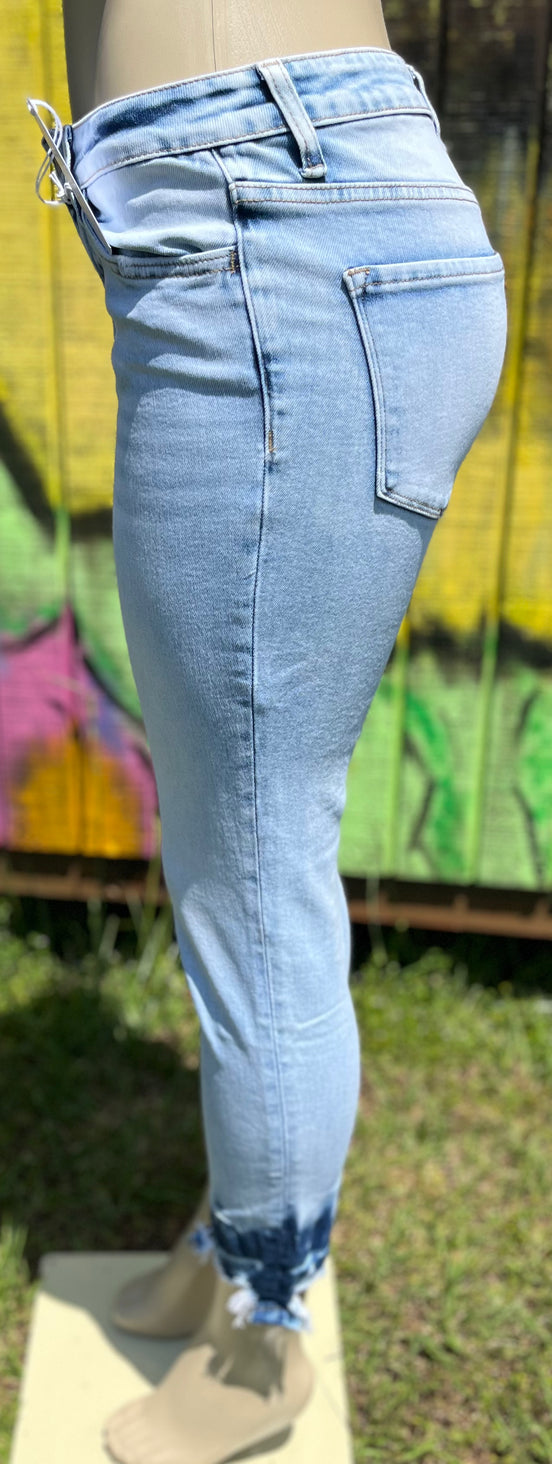 Vervet mid-rise skinny jeans in classic blue denim, fitted style with front pockets and belt loops, close-up view of fabric and stitching