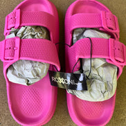 Roxoni slip-on sandals featuring a comfortable design with open toes and casual style for everyday wear.