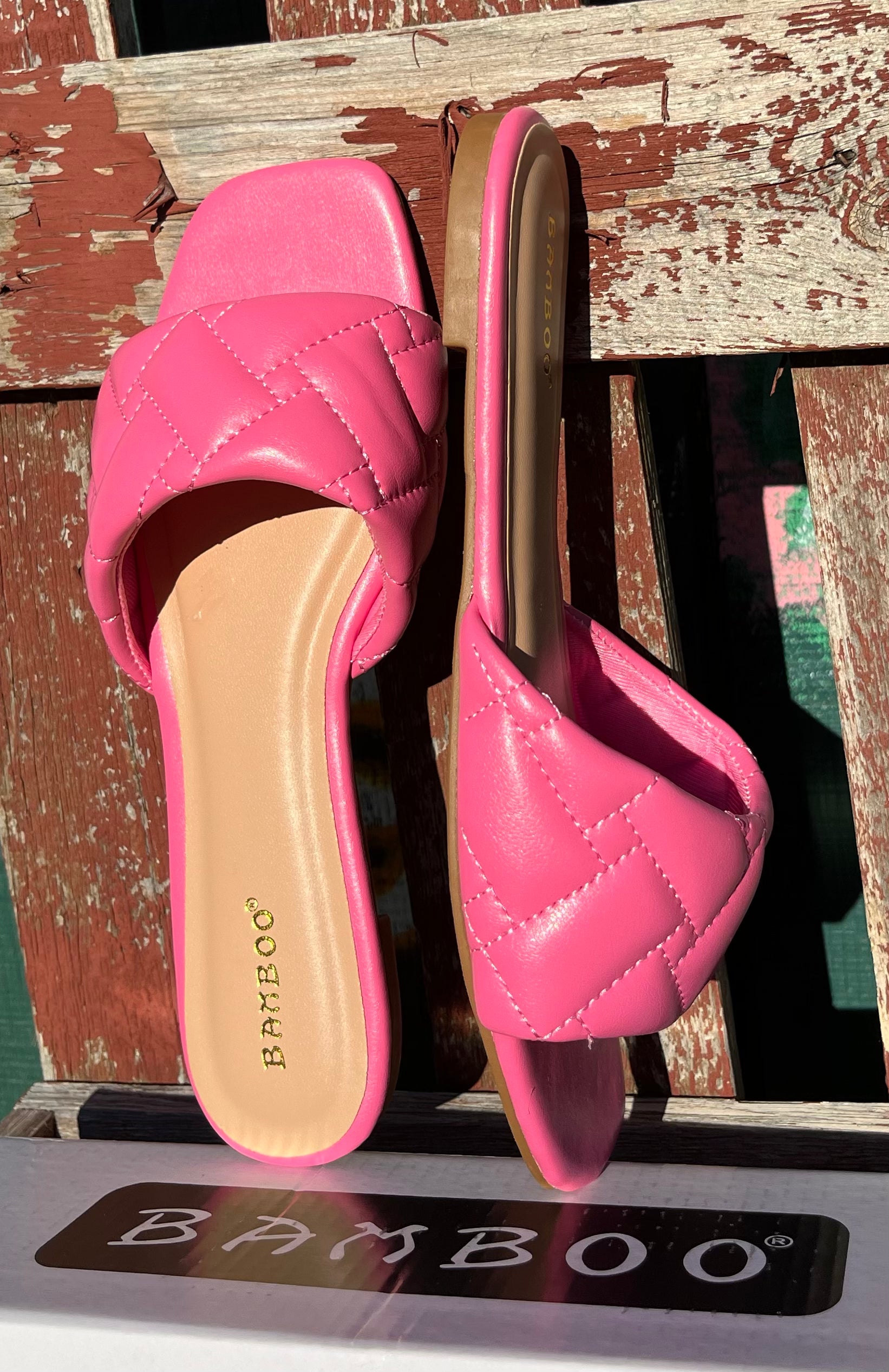 Pink Stella Shoes sandals with open toes and ankle straps, stylish summer footwear on a white background.