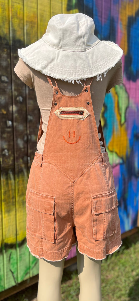 Oli&Hali washed cargo romper featuring a relaxed fit, multiple pockets, and casual style for everyday wear.