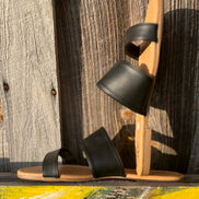 Black strap sandals from Miami Shoe featuring open toe design and ankle strap for casual summer wear.