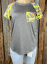 Celeste Clothing brand. Charcoal gray bodice with multicolored leopard short sleeves in yellow, orange and gray top.